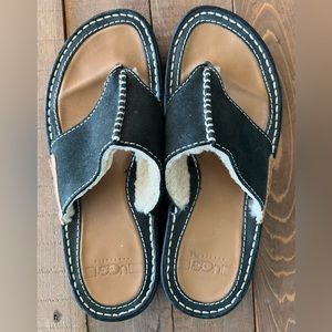 Barely worn UGG sandals with fuzzy lining to keep your feet warm.